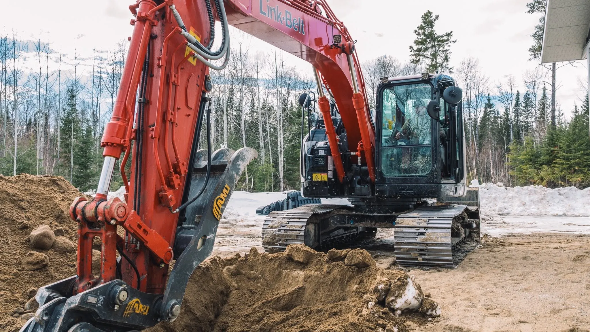 An excavator working a site for a Rega client